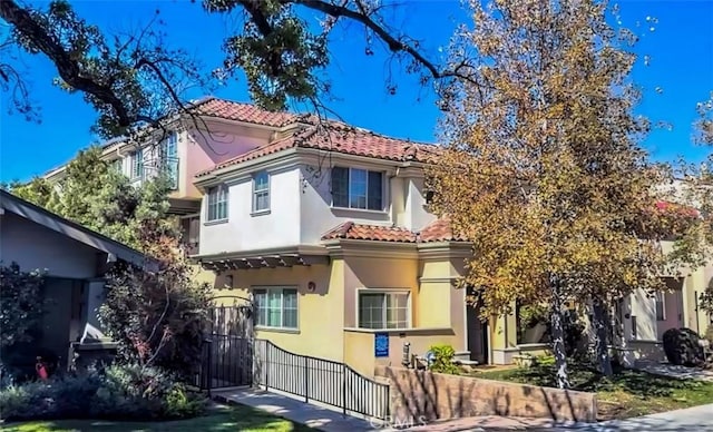1153 San Rafael Ave Unit 105, Glendale, CA 91202 - view of front of home with a tiled roof and stucco siding