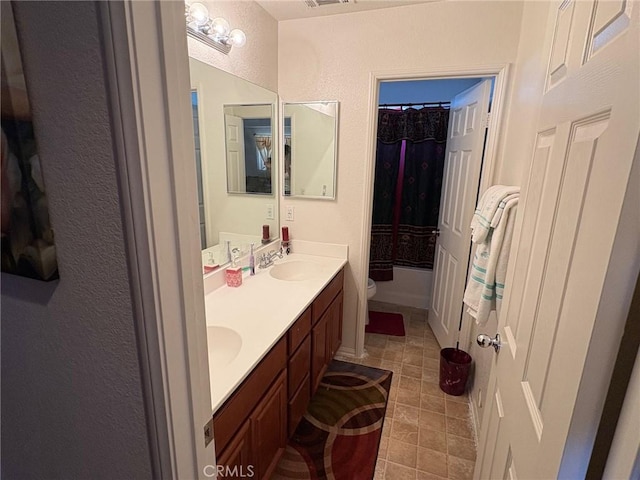 3324 Rosegold Ave, Rosamond, CA 93560 - bathroom with tile patterned flooring, double vanity, visible vents, toilet, and a sink