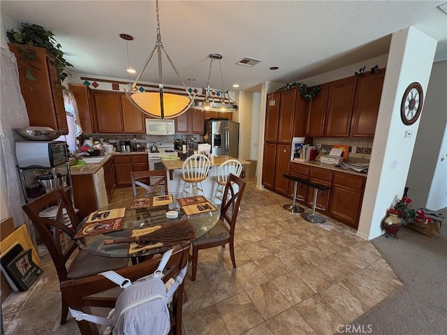 3324 Rosegold Ave, Rosamond, CA 93560 - dining space with visible vents