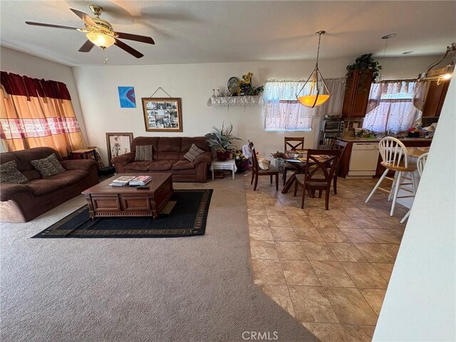3324 Rosegold Ave, Rosamond, CA 93560 - living area with a ceiling fan, light tile patterned floors, and light carpet