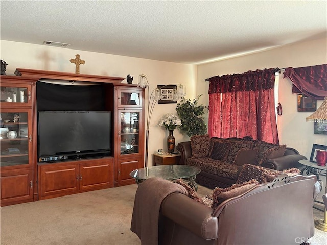 3324 Rosegold Ave, Rosamond, CA 93560 - living area with a textured ceiling, visible vents, and light carpet