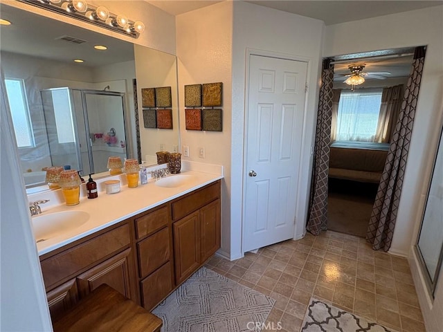3324 Rosegold Ave, Rosamond, CA 93560 - full bathroom with ceiling fan, visible vents, a sink, and a stall shower