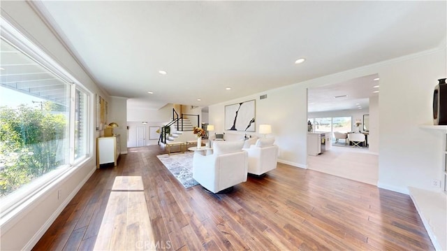 19201 Barrett Ln, North Tustin, CA 92705 - living area with stairs, dark wood-style floors, recessed lighting, baseboards, and crown molding