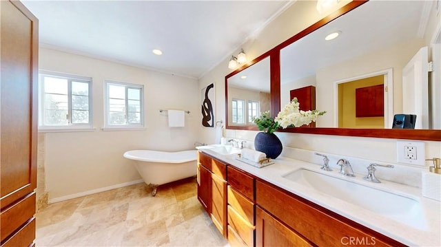 19201 Barrett Ln, North Tustin, CA 92705 - full bathroom with double vanity, a freestanding bath, ornamental molding, baseboards, and recessed lighting