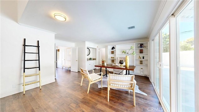 19201 Barrett Ln, North Tustin, CA 92705 - dining space with wood finished floors, crown molding, and baseboards