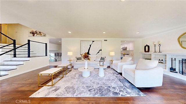 19201 Barrett Ln, North Tustin, CA 92705 - living room featuring stairway, hardwood / wood-style floors, recessed lighting, baseboards, and a fireplace with raised hearth