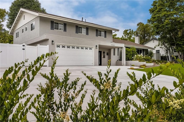 19201 Barrett Ln, North Tustin, CA 92705 - view of front of property featuring concrete driveway, an attached garage, and stucco siding