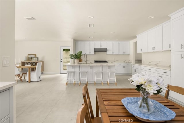 19201 Barrett Ln, North Tustin, CA 92705 - dining room with light tile patterned floors and recessed lighting