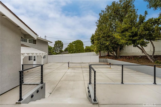 19201 Barrett Ln, North Tustin, CA 92705 - view of tennis court with a fenced backyard and a patio area