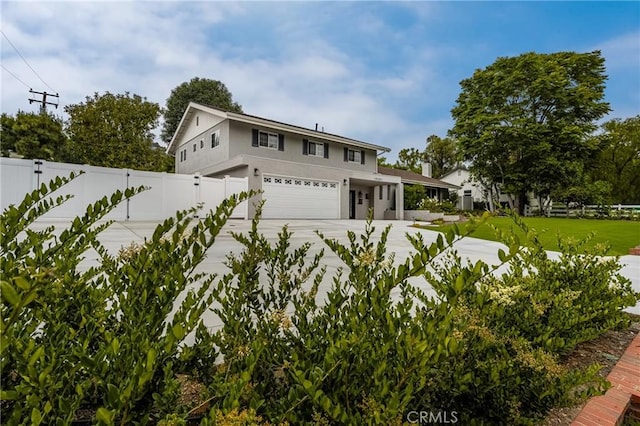 19201 Barrett Ln, North Tustin, CA 92705 - traditional-style home featuring a garage, driveway, and stucco siding