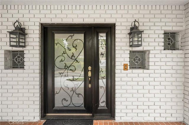 19201 Barrett Ln, North Tustin, CA 92705 - view of exterior entry featuring brick siding