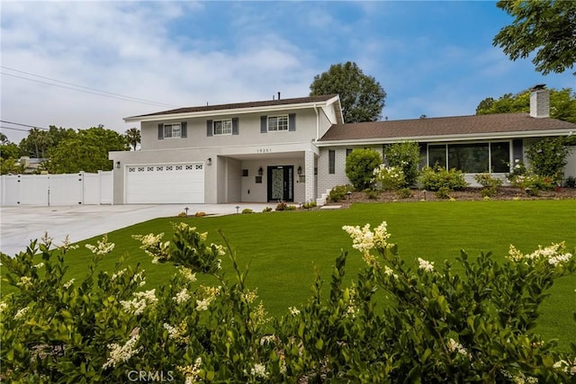 19201 Barrett Ln, North Tustin, CA 92705 - traditional-style home with a garage, driveway, a gate, stucco siding, and a chimney