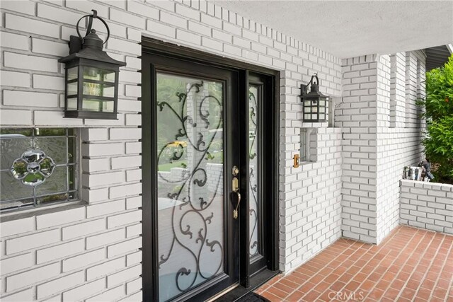 19201 Barrett Ln, North Tustin, CA 92705 - property entrance with brick siding and covered porch
