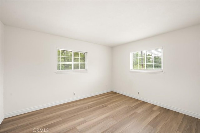 19201 Barrett Ln, North Tustin, CA 92705 - spare room with light wood-style floors and healthy amount of natural light