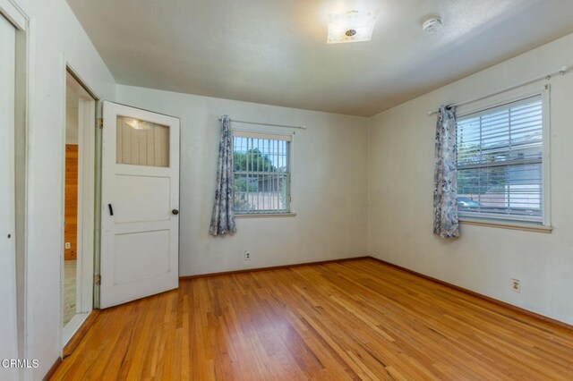 524 N 14th St, Santa Paula, CA 93060 - empty room with light wood-style floors, a smoke detector, and baseboards