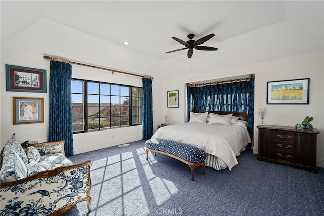 bedroom with carpet, visible vents, baseboards, and ceiling fan