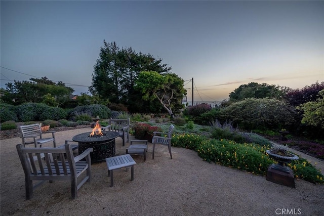 view of patio with a fire pit