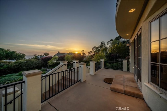 view of balcony at dusk
