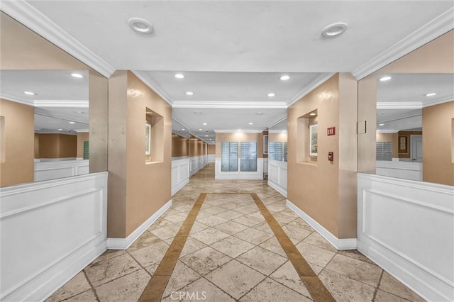 corridor with crown molding and baseboards