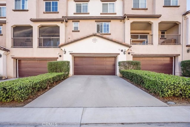 40925 Lacroix Ave, Murrieta, CA 92562 - view of property featuring a garage, stucco siding, and concrete driveway