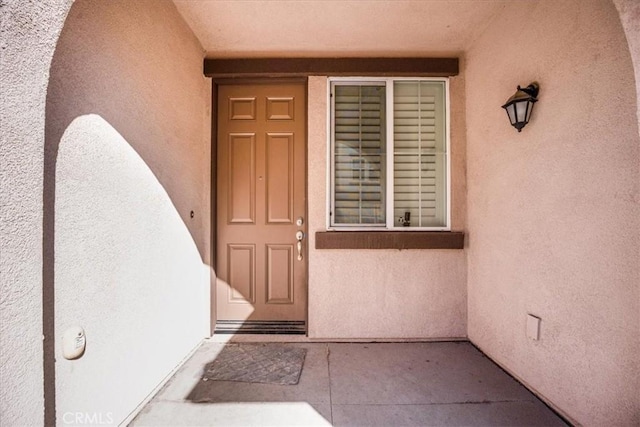 40925 Lacroix Ave, Murrieta, CA 92562 - doorway to property with stucco siding