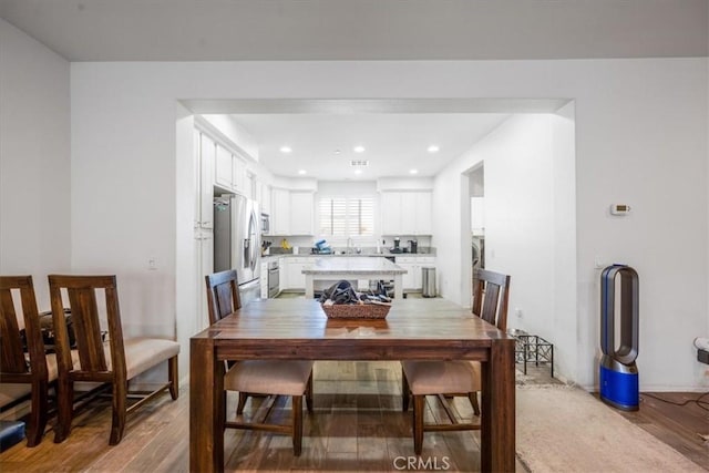 40925 Lacroix Ave, Murrieta, CA 92562 - dining room with light wood-style flooring and recessed lighting