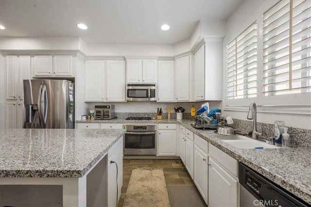 40925 Lacroix Ave, Murrieta, CA 92562 - kitchen featuring recessed lighting, a sink, white cabinetry, and stainless steel appliances