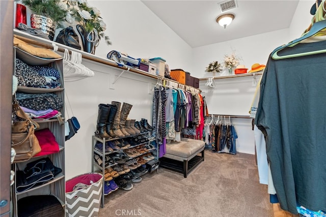 walk in closet with visible vents and carpet floors