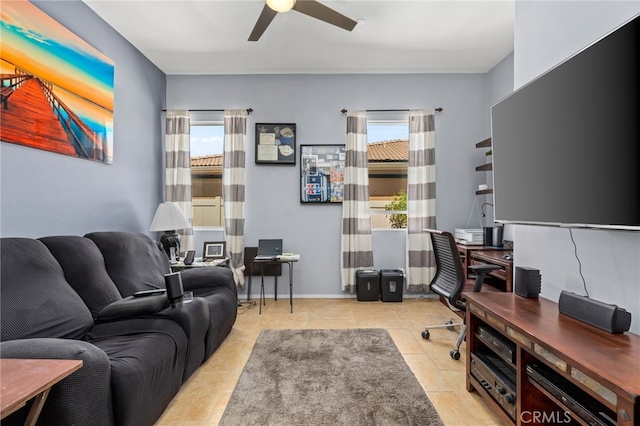 tiled office space featuring a ceiling fan