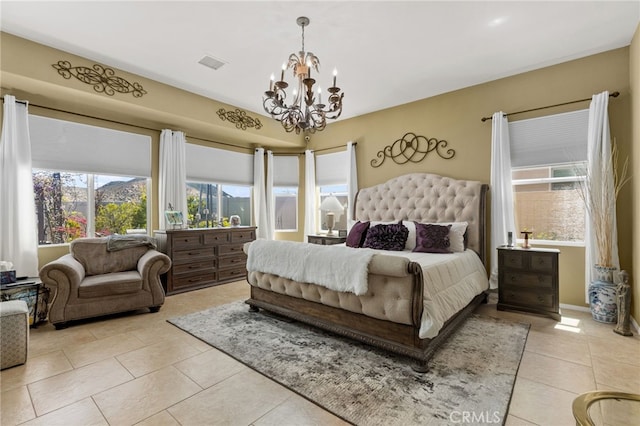 bedroom featuring a notable chandelier, visible vents, and light tile patterned flooring