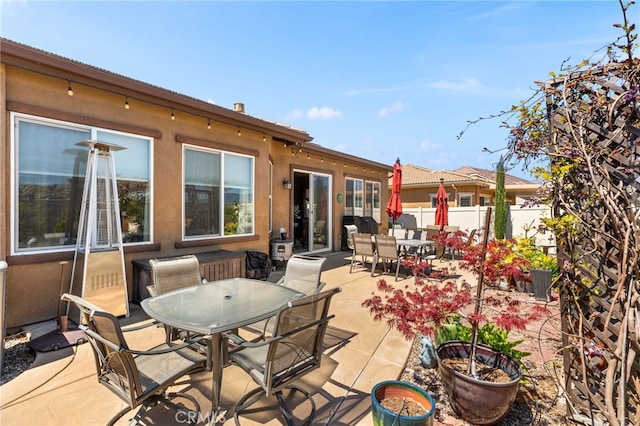 view of patio / terrace featuring outdoor dining space and fence