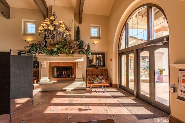 interior space featuring french doors and an inviting chandelier