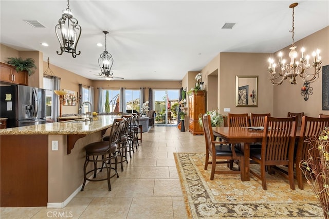dining room with recessed lighting, visible vents, and an inviting chandelier