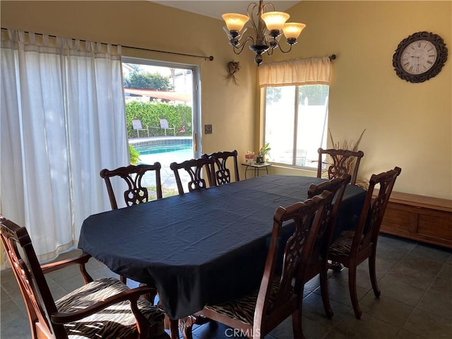 dining room with tile patterned flooring, a chandelier, and a healthy amount of sunlight