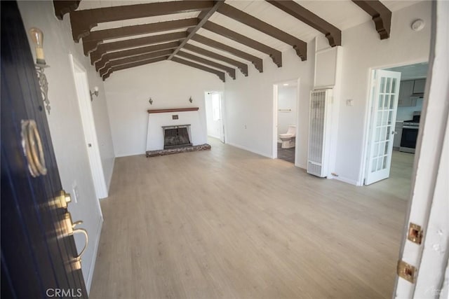 1078 Maple St, Arroyo Grande, CA 93420 - unfurnished living room featuring light wood-style floors, lofted ceiling with beams, and a brick fireplace