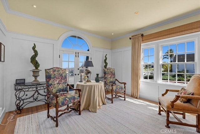 1239 S Patton Ave, San Pedro, CA 90731 - sitting room with a decorative wall, wood finished floors, french doors, and crown molding