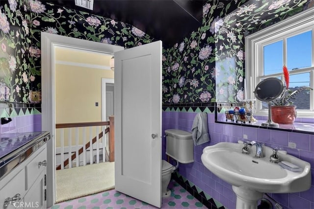 1239 S Patton Ave, San Pedro, CA 90731 - bathroom featuring wallpapered walls, tile walls, and a wainscoted wall