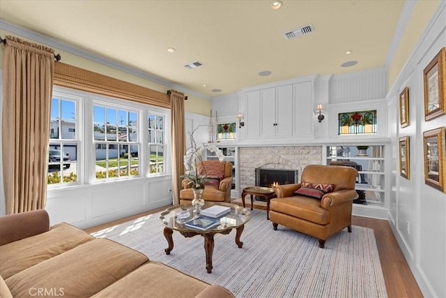 1239 S Patton Ave, San Pedro, CA 90731 - living area featuring wood finished floors, a fireplace, ornamental molding, and recessed lighting