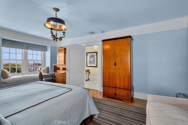 1239 S Patton Ave, San Pedro, CA 90731 - bedroom with wood finished floors and baseboards