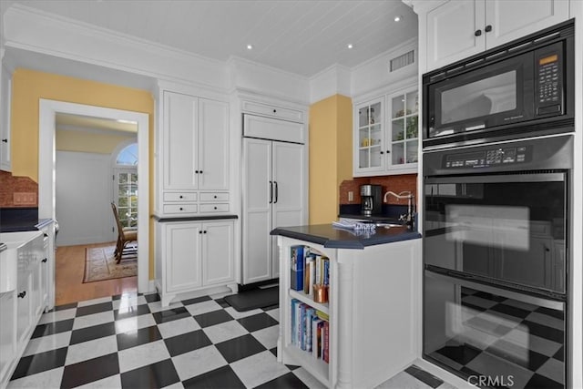 1239 S Patton Ave, San Pedro, CA 90731 - kitchen with black appliances, tile patterned floors, white cabinetry, dark countertops, and wine cooler