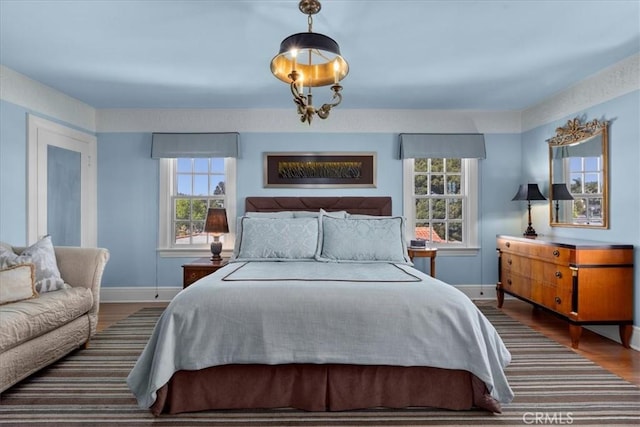 1239 S Patton Ave, San Pedro, CA 90731 - bedroom featuring multiple windows and wood finished floors