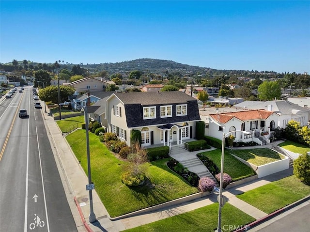1239 S Patton Ave, San Pedro, CA 90731 - view of front of house with a residential view, a front yard, and a shingled roof