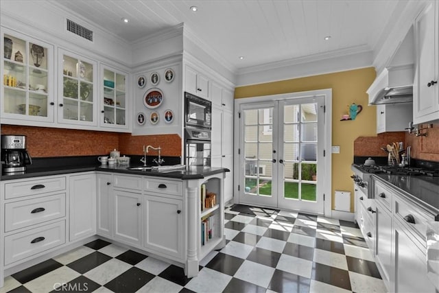 1239 S Patton Ave, San Pedro, CA 90731 - kitchen featuring light flooring, french doors, dark countertops, stainless steel appliances, and recessed lighting