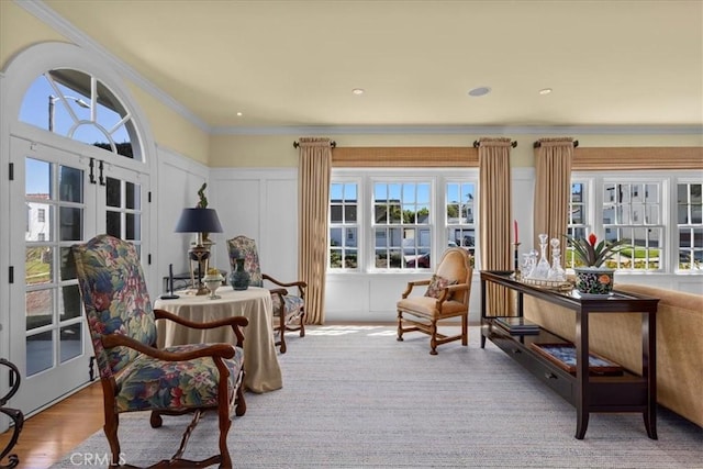 1239 S Patton Ave, San Pedro, CA 90731 - sitting room featuring plenty of natural light, a decorative wall, crown molding, wood finished floors, and a wainscoted wall