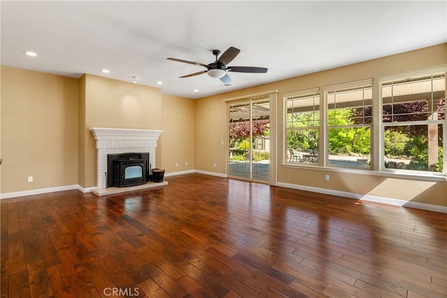 unfurnished living room featuring recessed lighting, hardwood / wood-style floors, baseboards, and a ceiling fan