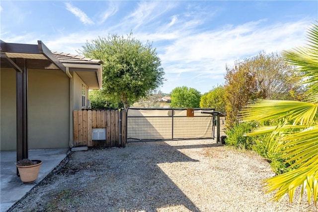 view of gate featuring fence