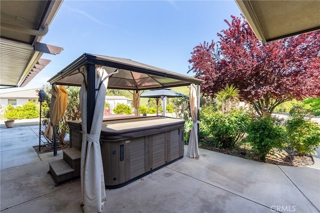 view of patio with a gazebo and a hot tub