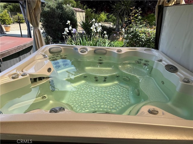 exterior details featuring a hot tub