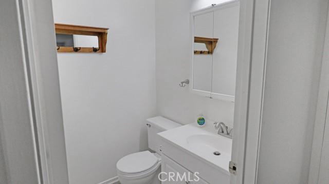 bathroom with toilet and vanity