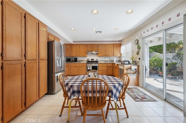 kitchen featuring visible vents, light countertops, under cabinet range hood, recessed lighting, and stainless steel appliances